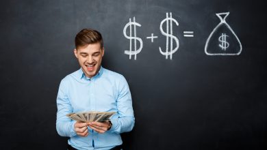 handsome man standing over blackboard with drawn dollar concept