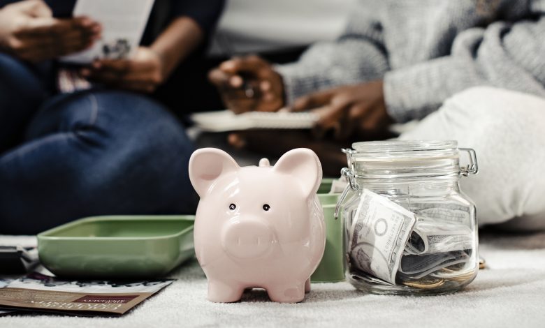 mother teaching her daughter about savings