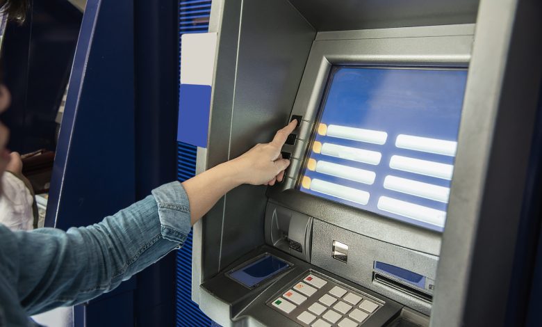 people waiting to get money from automated teller machine people withdrawn money from atm concept