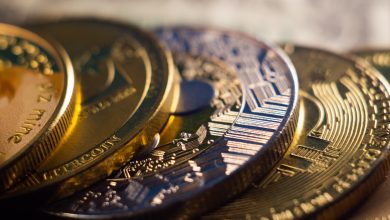 closeup shot of a pile of cryptocurrency cash golden coins