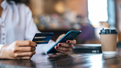 pay for goods by credit card through a smartphone in a coffee shop